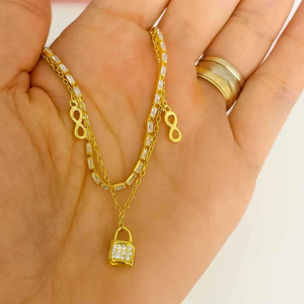 Brățară L’amour Scellé din argint 925 placată cu aur 14K, cu lacăt și simbol infinit